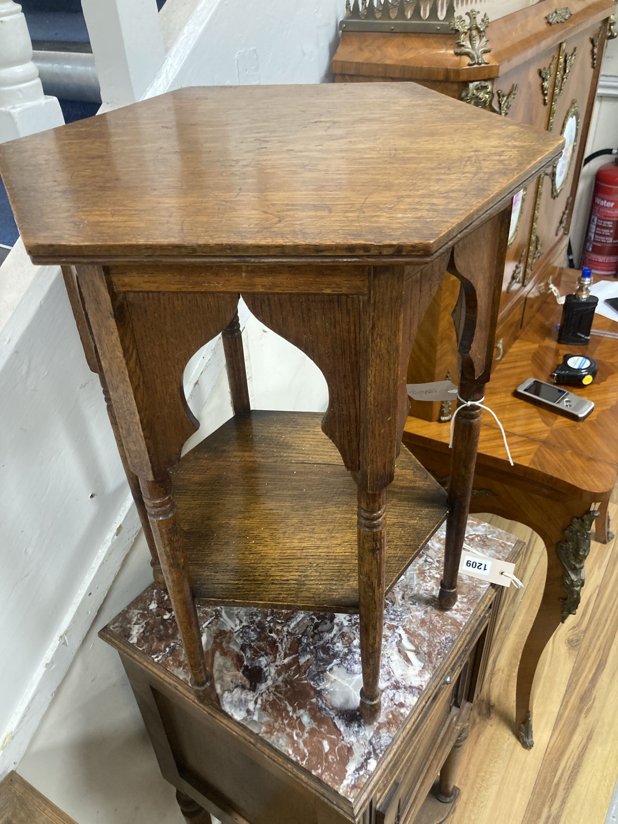 An early 20th century Moorish style hexagonal oak occasional table, width 36cm, height 51cm